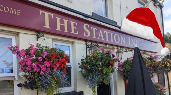 Exterior of the Station Inn Silkstone Common with Flower Baskets